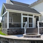 screened-in a-frame porch with outdoor deck and grilling station