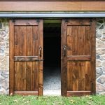 outdoor storage room doors surrounded by stone work