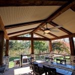 Neumoyer - trex spiced rum deck and barn wood porch with stone columns