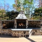 Neumoyer - trex spiced rum deck with mocha border with stone fire feature