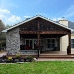 Logan - porch built with stone and barn wood