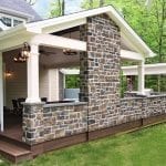 Arjan Timbertech Deck and porch with stonework and lighting