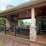 Beck - TimberTech deck and porch with fireplace and TV