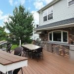 Chonko Trex deck with stonework kitchen curved bar bumpout north whale pa