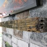 Houp - Stonework with barnwood mantel
