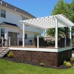 Weiss - timbertech tropical antique palm deck with pergola and lattice