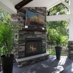 Custom Amazon Mist TimberTech Deck Porch Patio with stone fireplace and television Collegeville, PA