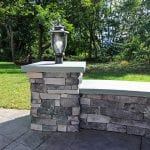Custom Amazon Mist TimberTech Deck Porch Patio with stone wall and light post in Collegeville, PA
