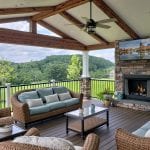 Osifat - timbertech mocha deck and porch with stone fireplace and tv