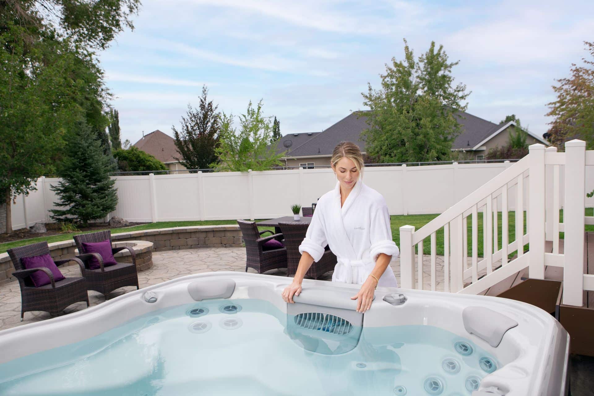 woman adjusting the filter on a hot tub