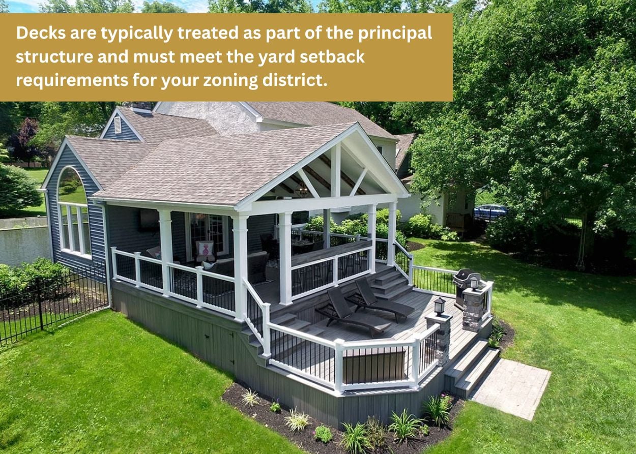 Elevated backyard deck with covered roof structure and seating area in Hampden Township PA