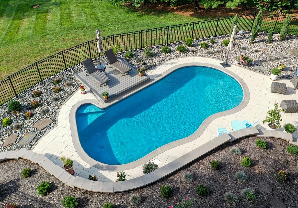 overhead view of concrete pool and patio showing depth