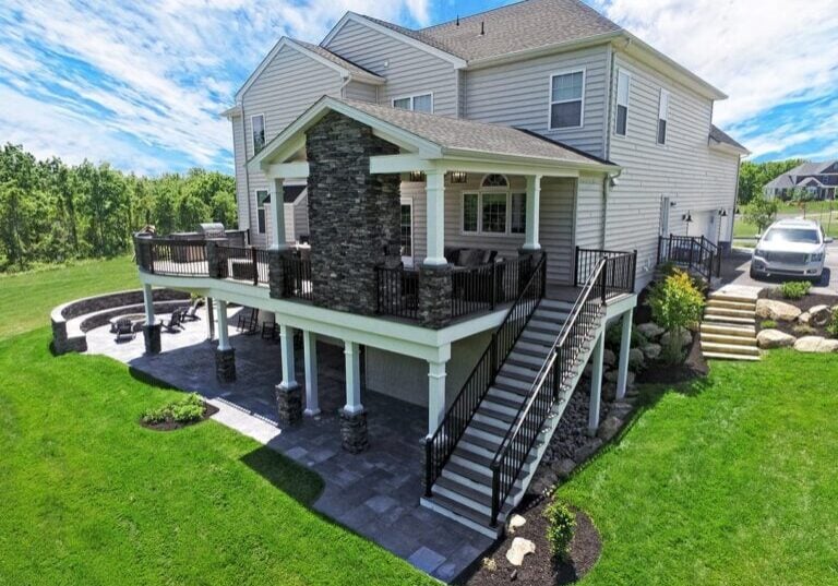 deck and porch with stone