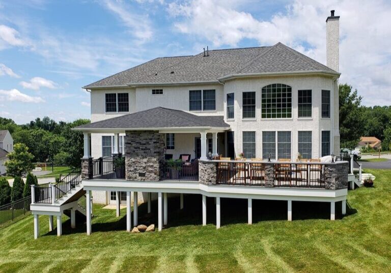 Kielinski – timbertech silver maple deck and porch with Pennsylvania ledgestone veneer stonework
