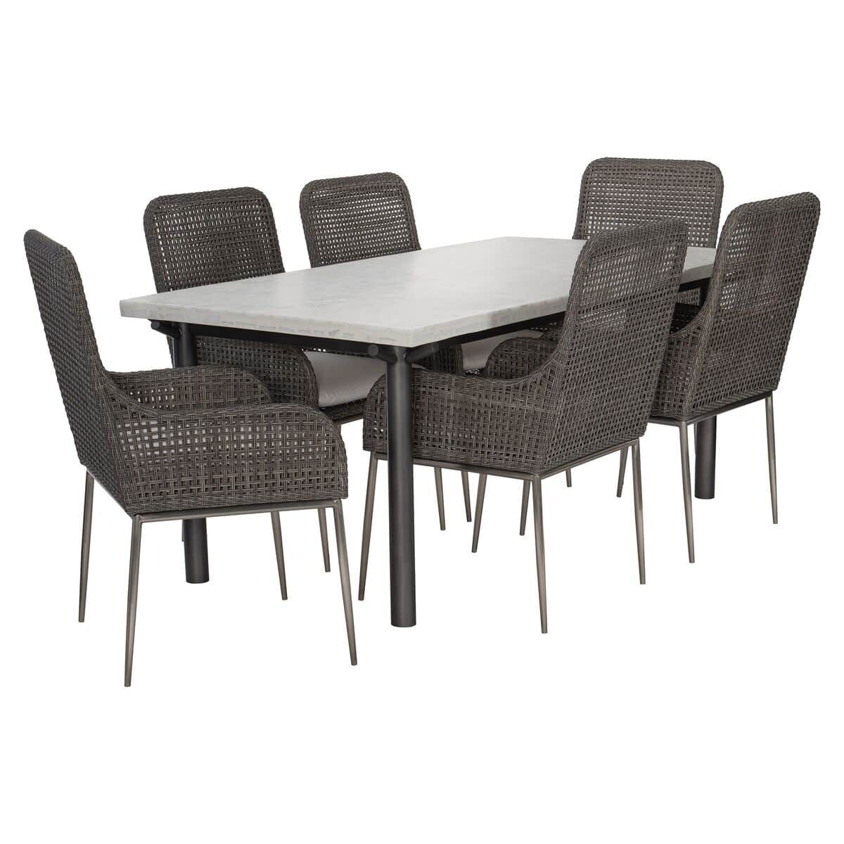 Large-X01224_Sanibel_X0161WX_Antilles_GroupAngle A rectangular outdoor dining table with a light-colored top and six wicker chairs with metal legs arranged around it.