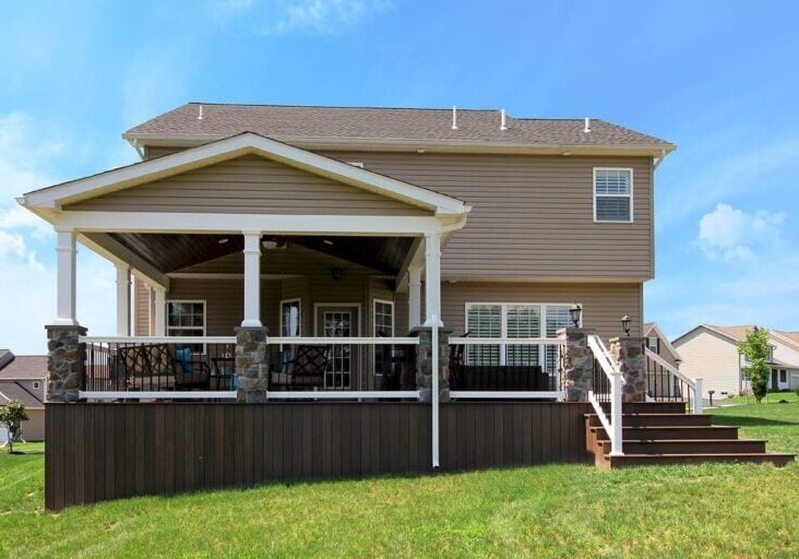 Soutner – Mocha TimberTech deck and porch with stonework