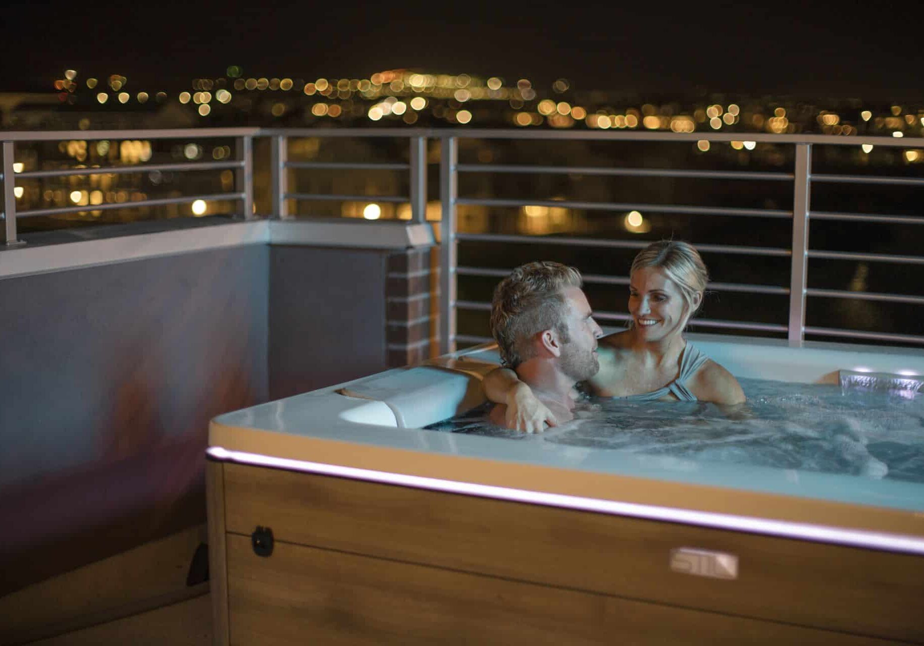 still-series-spas-hot-tubs6 romantic couple in a hot tub at night