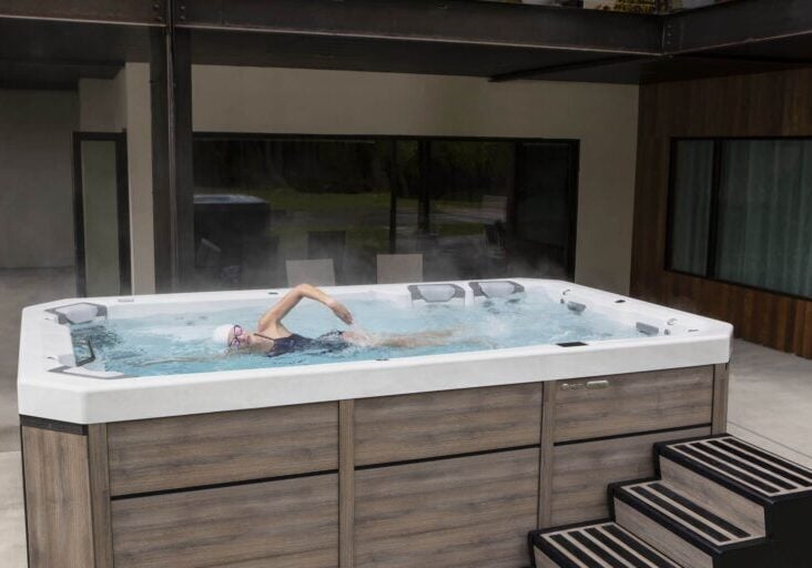 swimmer in flowing hot tub